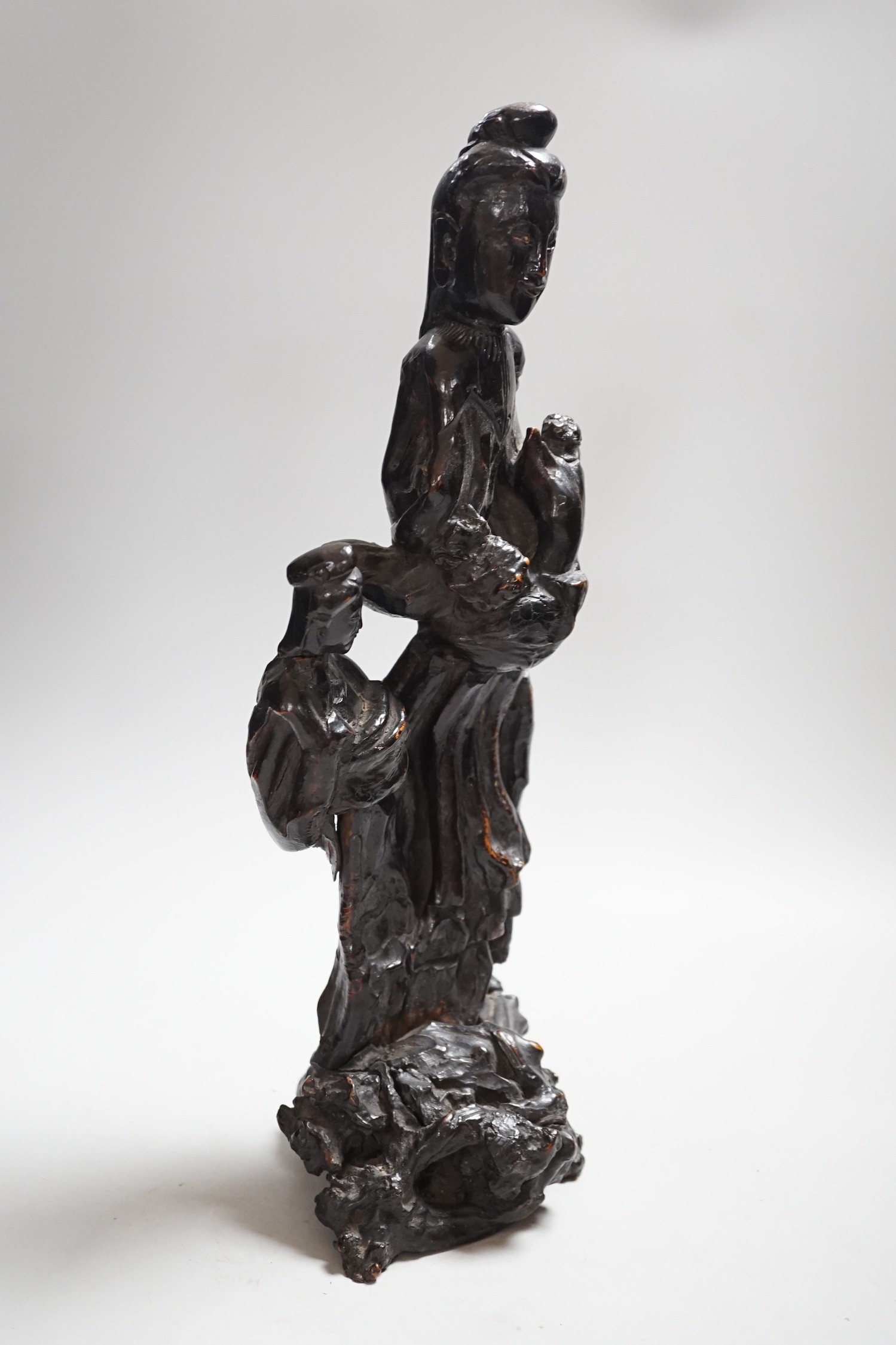 A Chinese root wood carving of two women, 42cm